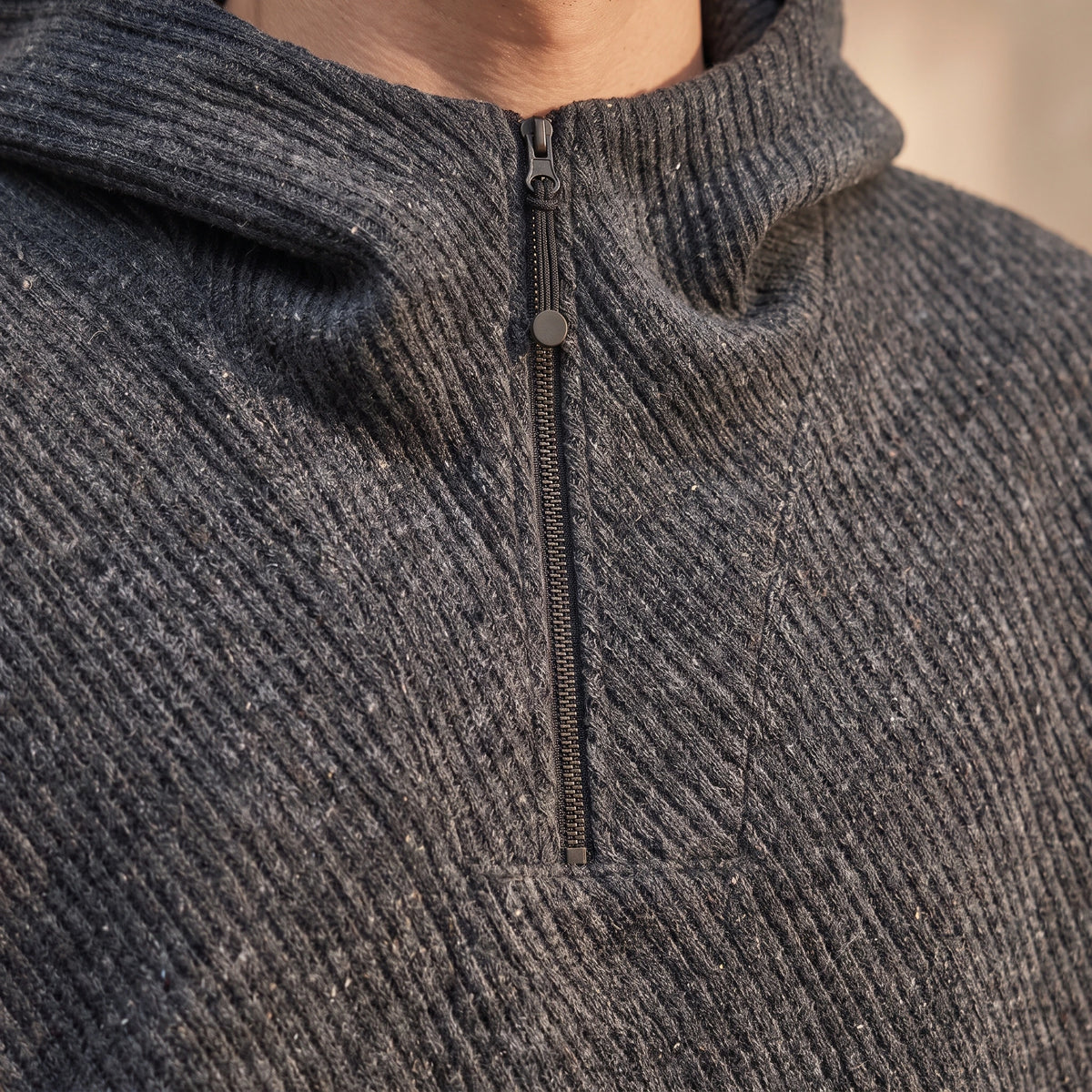 Ostrel Textured Hoodie close up of the quarter zip and diagonal ribbed knit texture