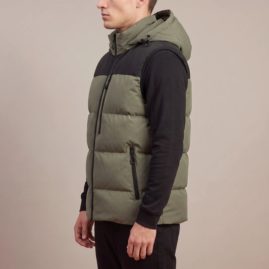 Ashcombe Utility Vest in Green - side view showing the armhole, side seam and vertical zipped pocket