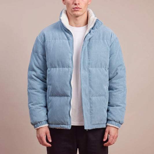 Morvane Fleece Puffer in blue, men's light blue corduroy puffer jacket with fleece-lined stand collar, worn front view