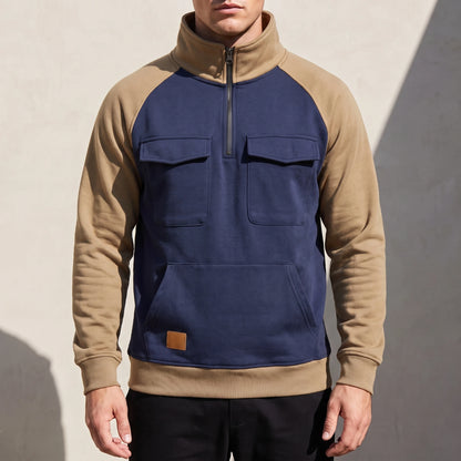 Calvano Half-Zip Sweatshirt in Navy - navy funnel-neck pullover with tan raglan sleeves worn by a model