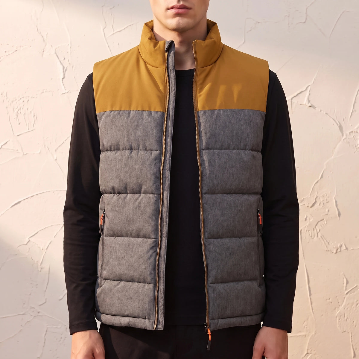 Halvard Padded Vest in Mustard - quilted sleeveless vest with mustard contrast yoke worn by a model