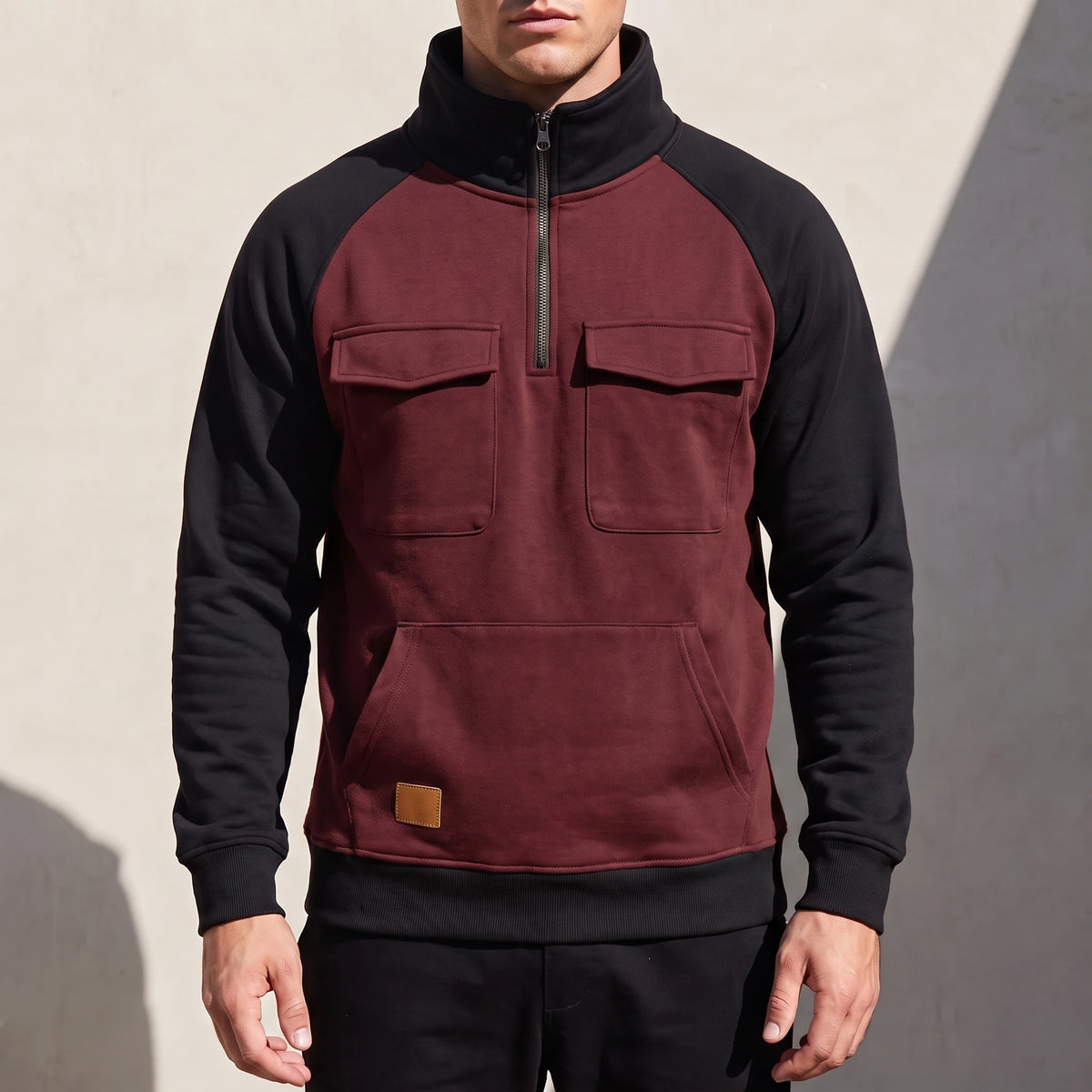 Calvano Half-Zip Sweatshirt in Burgundy - burgundy funnel-neck pullover with black raglan sleeves worn by a model