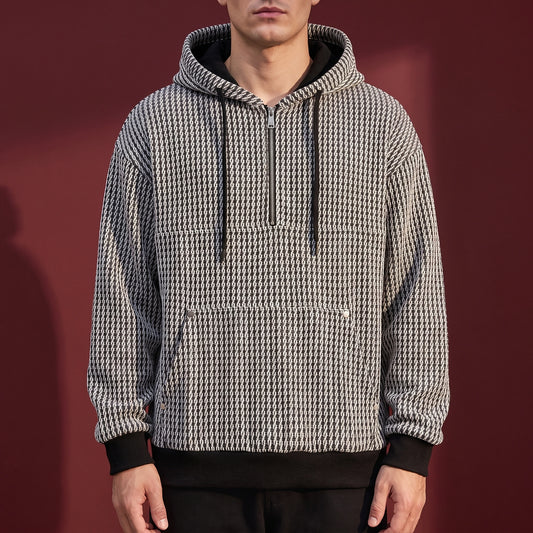Kaevik Waffle Hoodie in Grey - chunky waffle knit quarter-zip hoodie worn by a model