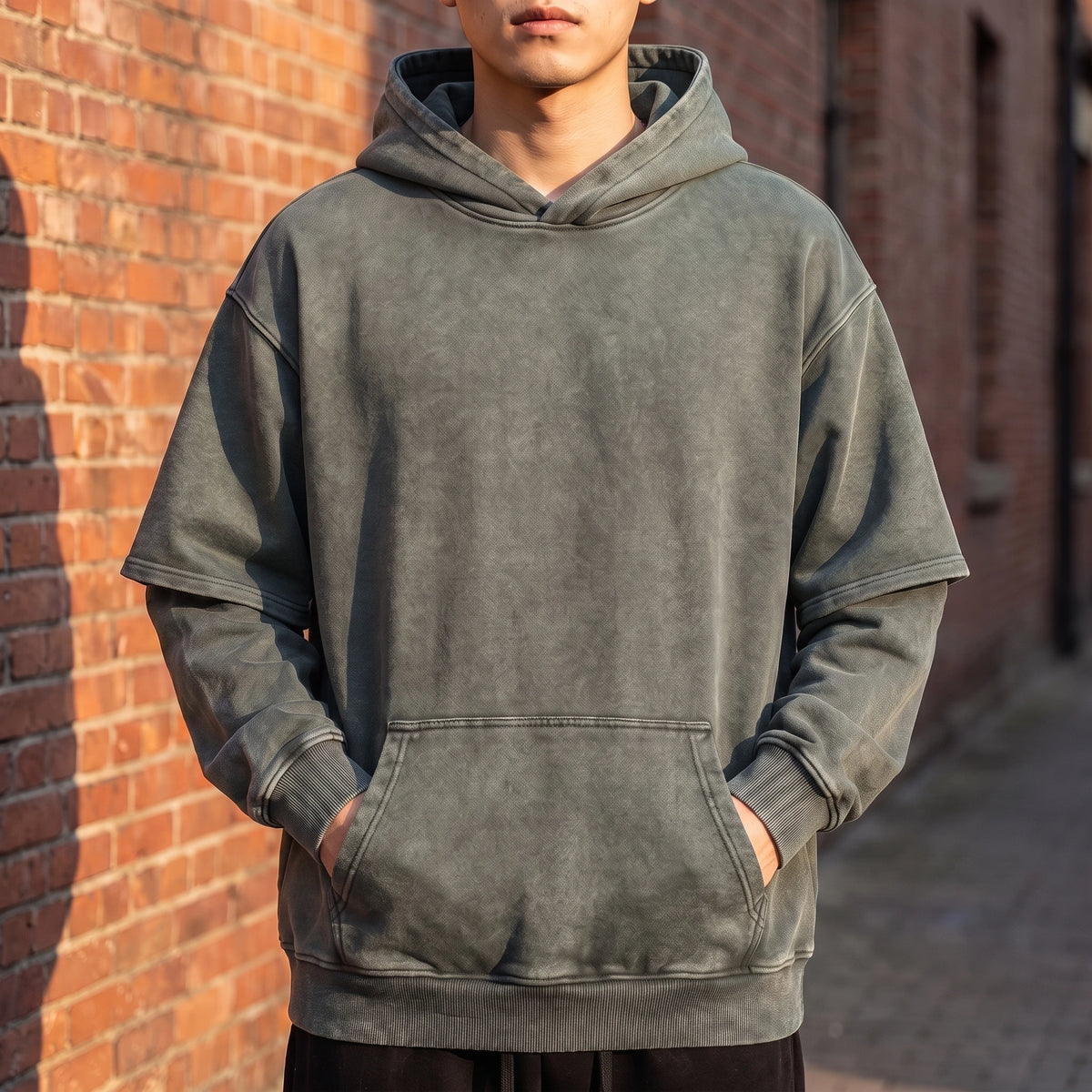 Corsten Washed Hoodie in Green, washed cotton oversized pullover hoodie with layered fake two-piece sleeves, worn front view