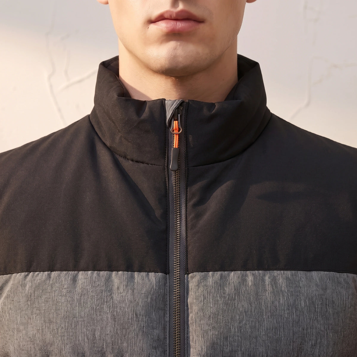 Halvard Padded Vest close-up detail - stand collar, yoke seam and copper zip pull