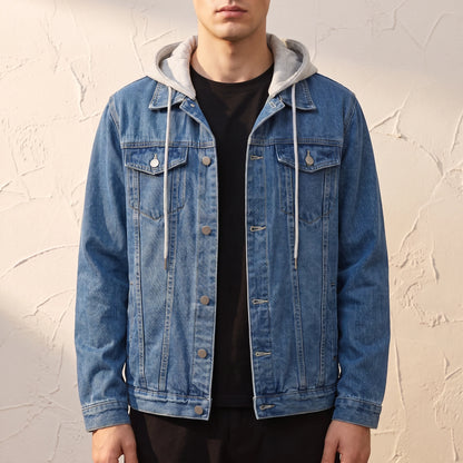Renvo Trucker Jacket in Blue, mid-wash denim trucker jacket with a detachable grey jersey hood, worn open over a black tee