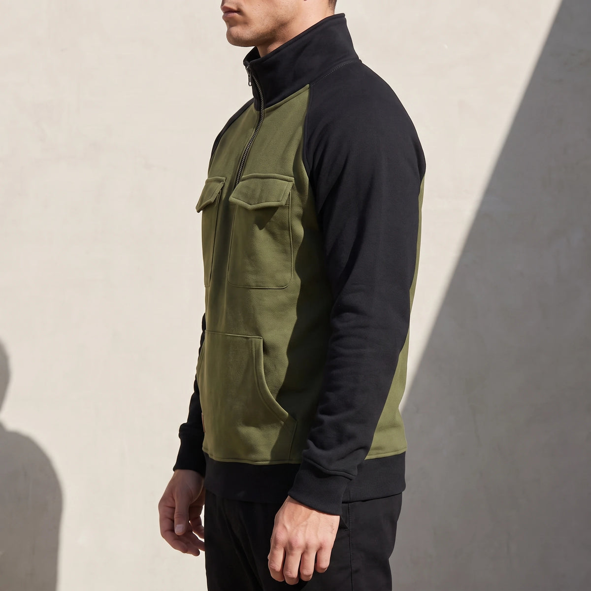 Calvano Half-Zip Sweatshirt in Green - side view showing kangaroo pouch pocket and ribbed hem
