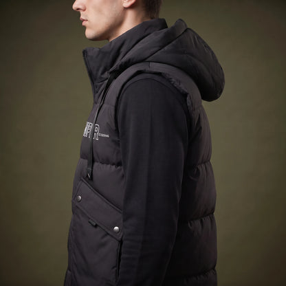 Norvell Hooded Gilet side view showing the bound armhole, quilted baffle depth and flap pocket press stud