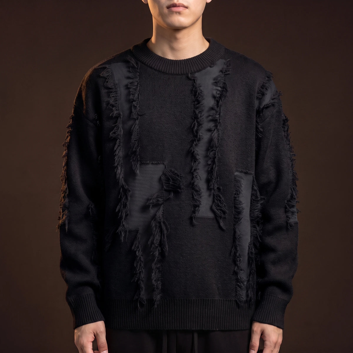 Verrick Distressed Sweater in Black, oversized crew-neck knit with torn frayed bands and tonal under-layer, worn front view