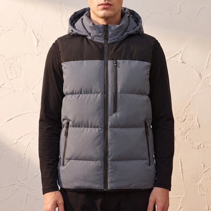 Ashcombe Utility Vest in Grey - padded sleeveless vest with detachable hood worn by a model