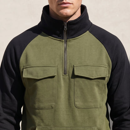 Calvano Half-Zip Sweatshirt close-up detail - tall funnel collar, gunmetal half zip and flap chest pockets