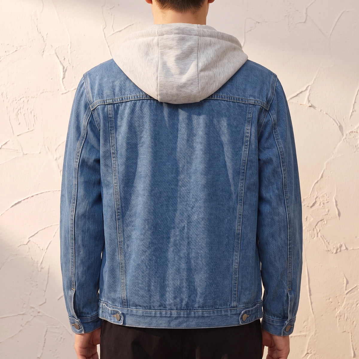 Renvo Trucker Jacket back view showing the plain unprinted denim back, yoke seam and buttoned waist tabs