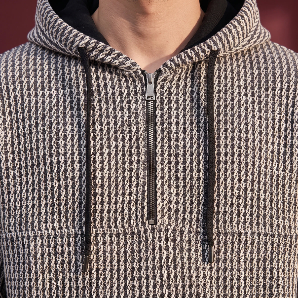 Kaevik Waffle Hoodie close-up detail - silver quarter zip, black hood lining and drawcords