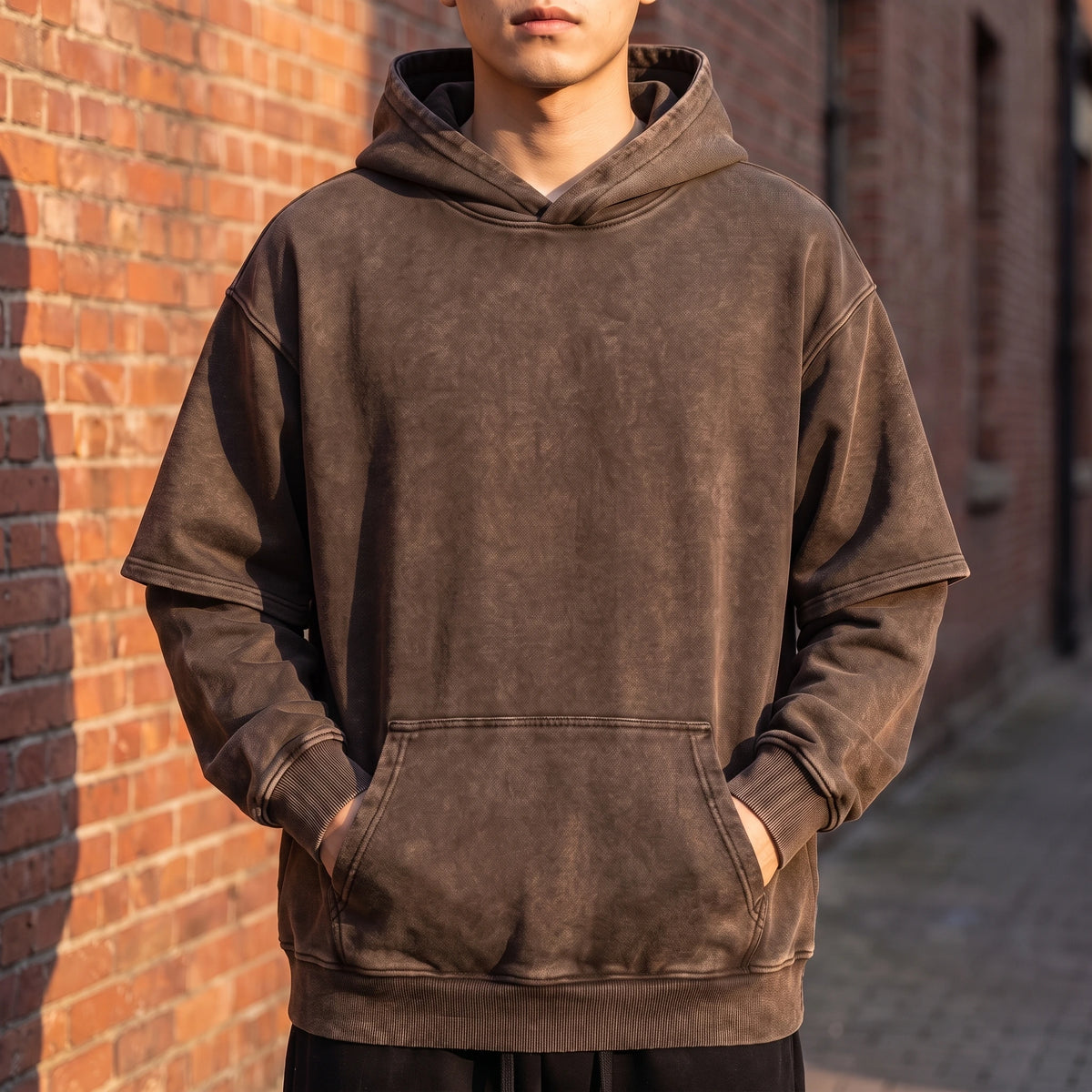 Corsten Washed Hoodie in Brown, washed cotton oversized pullover hoodie with layered fake two-piece sleeves, worn front view