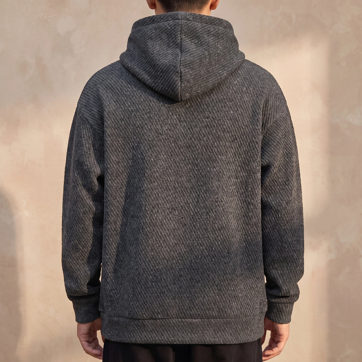 Ostrel Textured Hoodie back view showing the plain back panel and hood