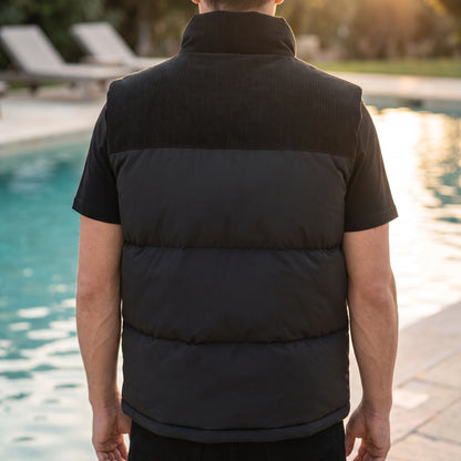 Brancourt Puffer Vest in Black - back view showing corduroy shoulder yoke and quilted channels