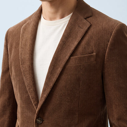 Ashford Corduroy Blazer in brown, men's two-button corduroy blazer with notch lapels, close-up of the lapel, chest pocket and corduroy texture