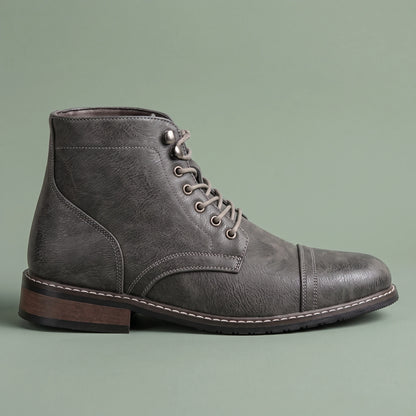 Brennan Cap-Toe Boot in grey, men's lace-up cap-toe ankle boot with speed hooks and stacked heel, side view