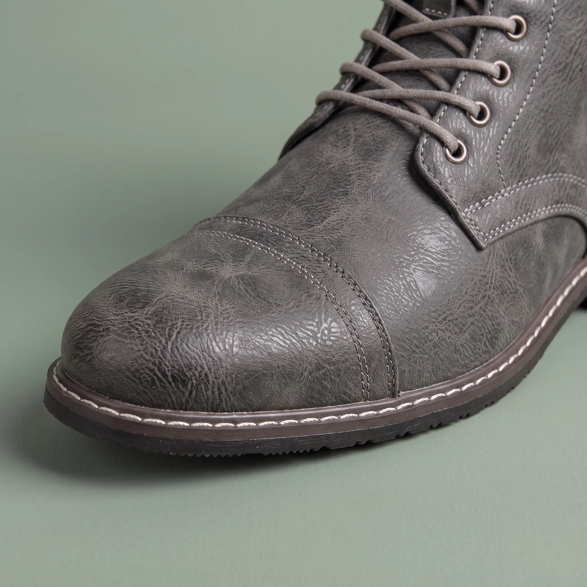 Brennan Cap-Toe Boot grey, close-up of the stitched cap toe and sole-edge stitching