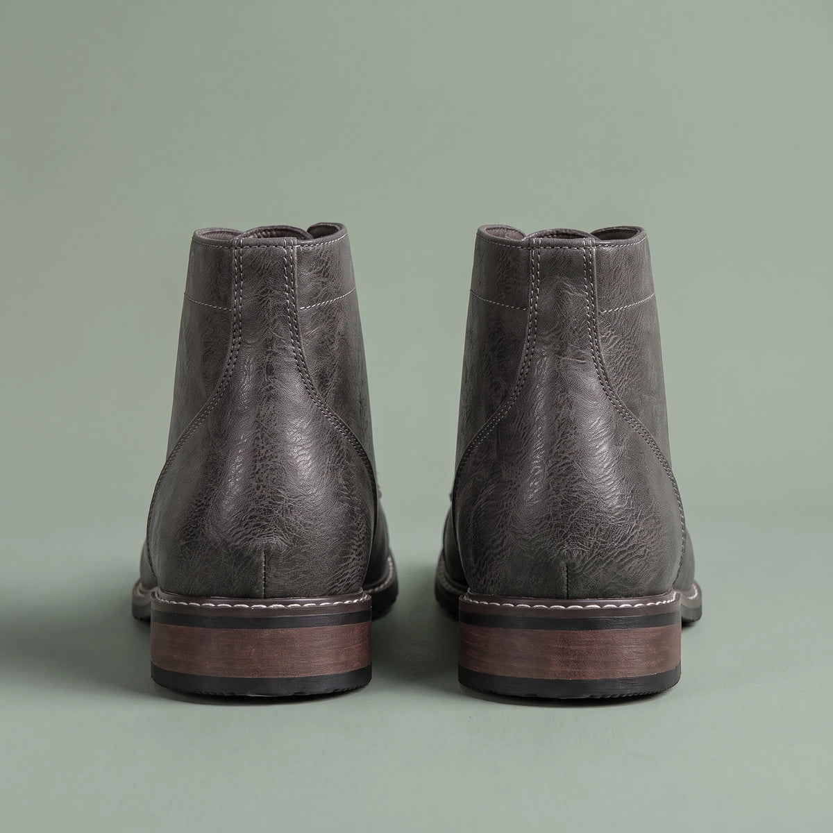 Brennan Cap-Toe Boot grey, pair shown from behind with stacked heels