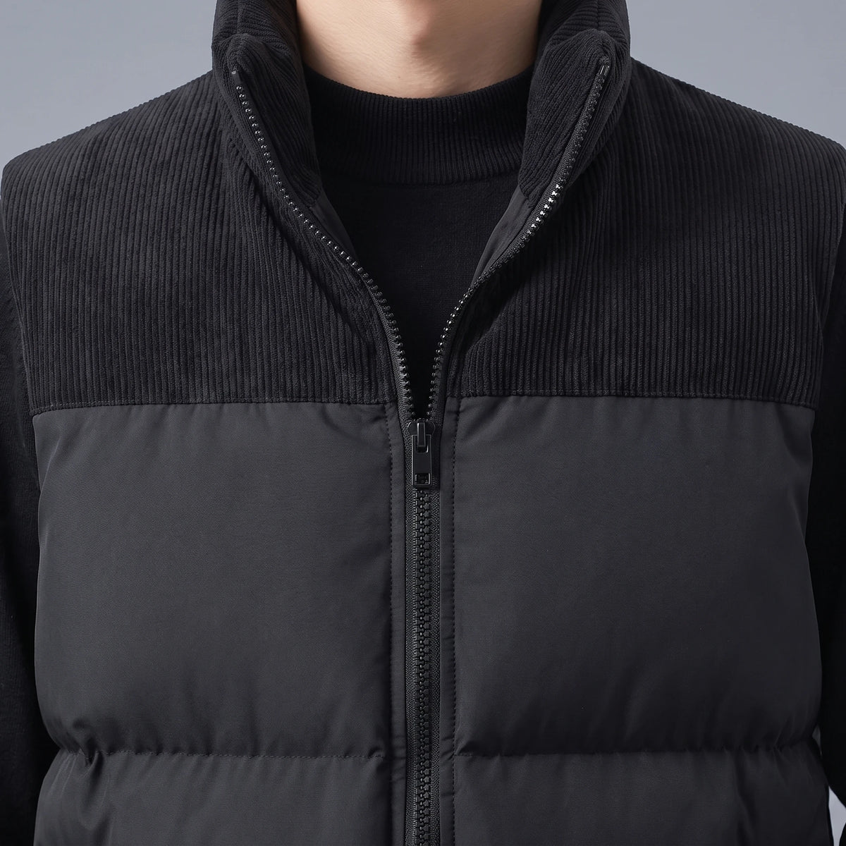 Brennick Puffer Vest close up of corduroy collar and yoke against the puffer body