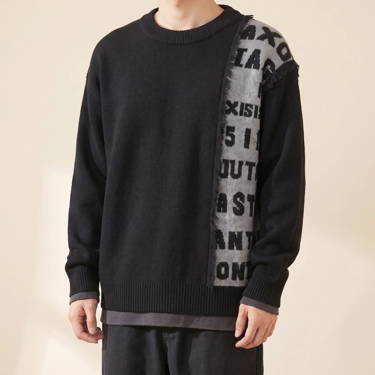 Brixton Fringe Sweater in black with grey letter panel, men's crew-neck knit sweater with a fringed letter panel, front view