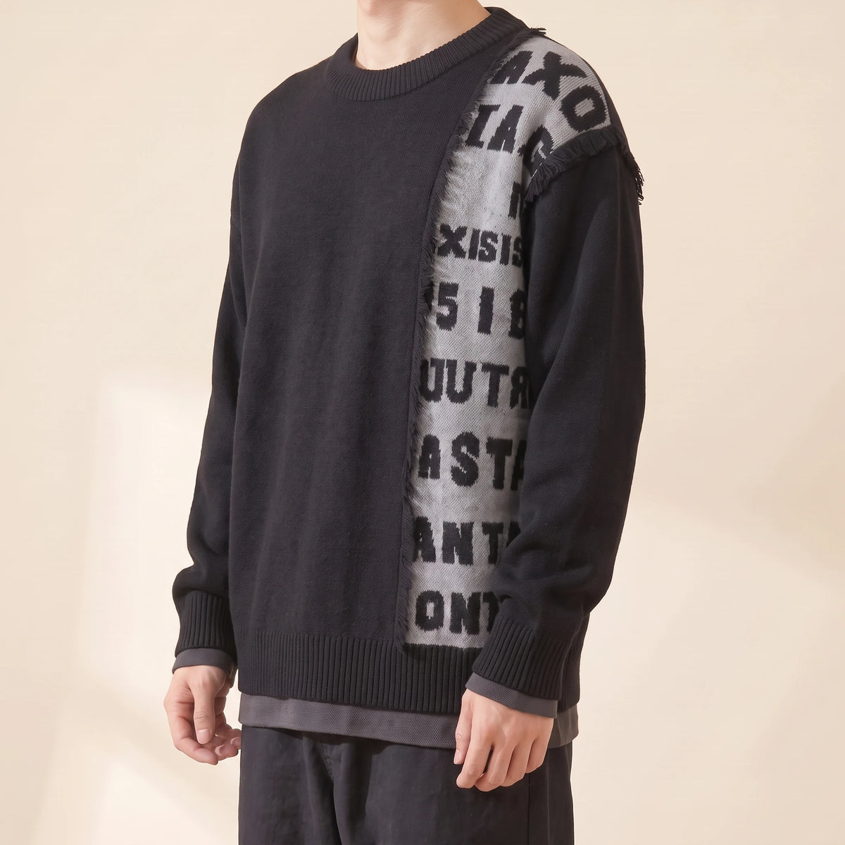 Brixton Fringe Sweater in black, men's crew-neck knit sweater with a fringed letter panel, side view