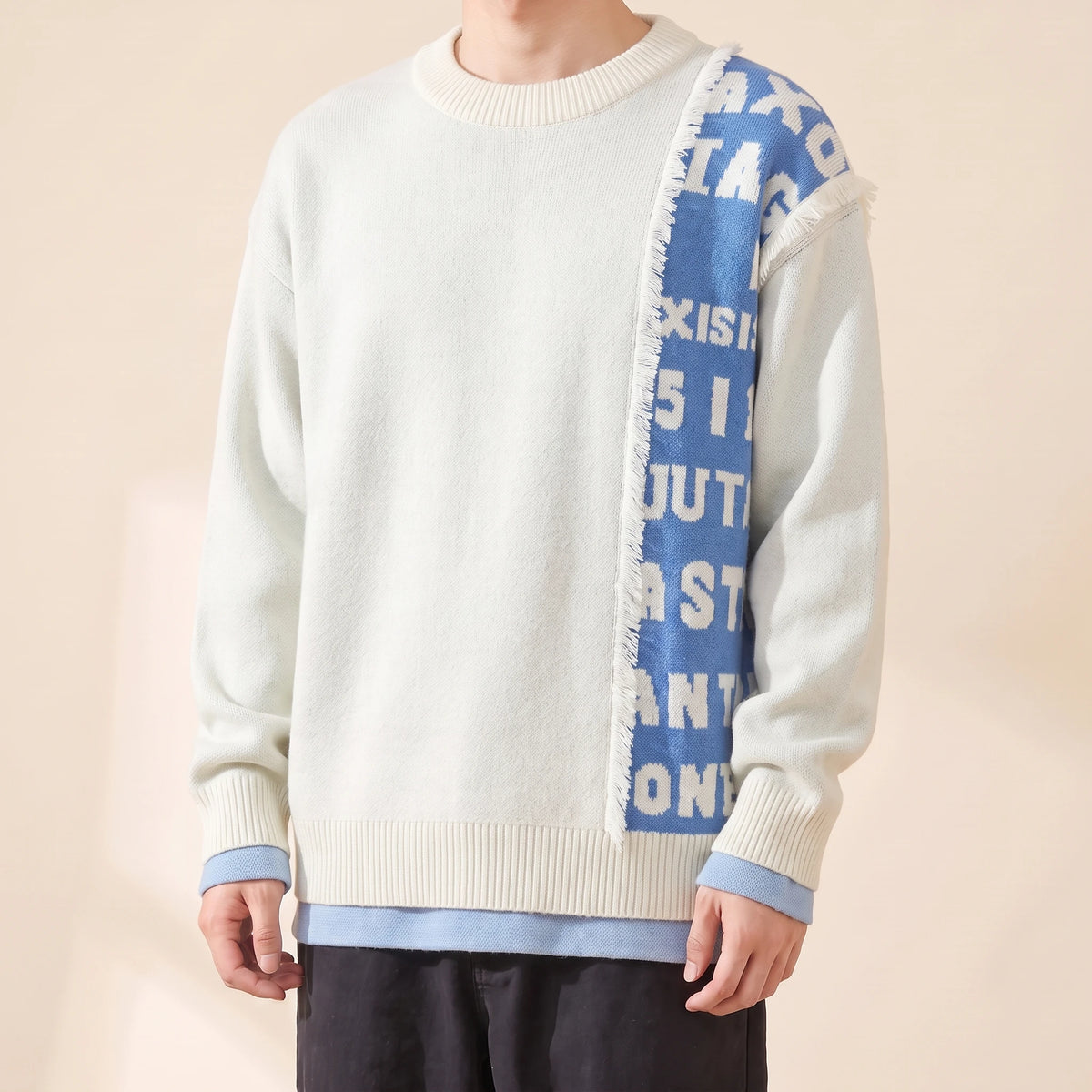 Brixton Fringe Sweater in white with blue letter panel, men's crew-neck knit sweater with a fringed letter panel, front view