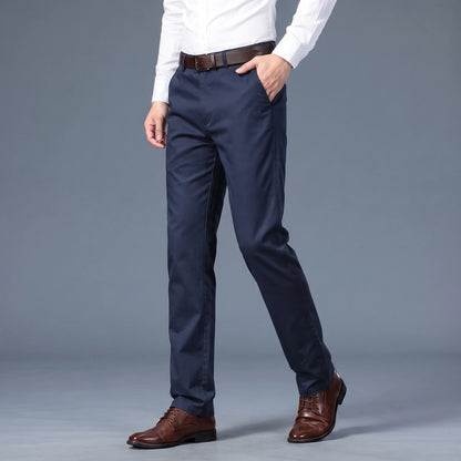 Callum Slim Chino in navy, men's slim flat-front chino trousers worn with a white shirt, front view