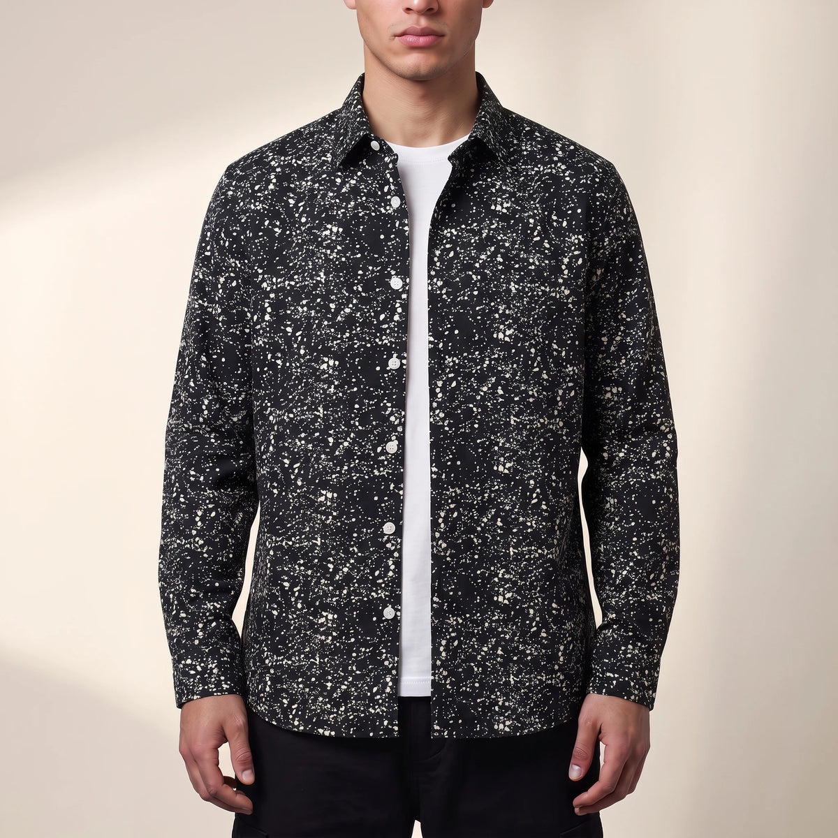 Dorian Layering Shirt in black, men's black shirt with white speckle print, worn open over a white tee