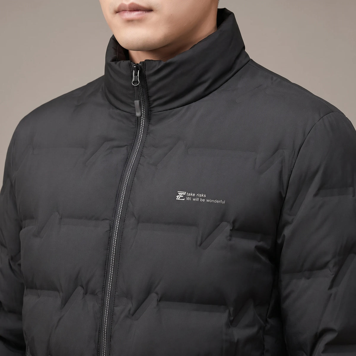 Halden Down Puffer close-up of stand collar, zip and quilted chest