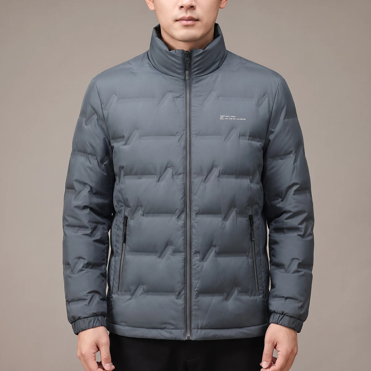 Halden Down Puffer in grey, men's short quilted puffer jacket with zip pockets, worn in studio