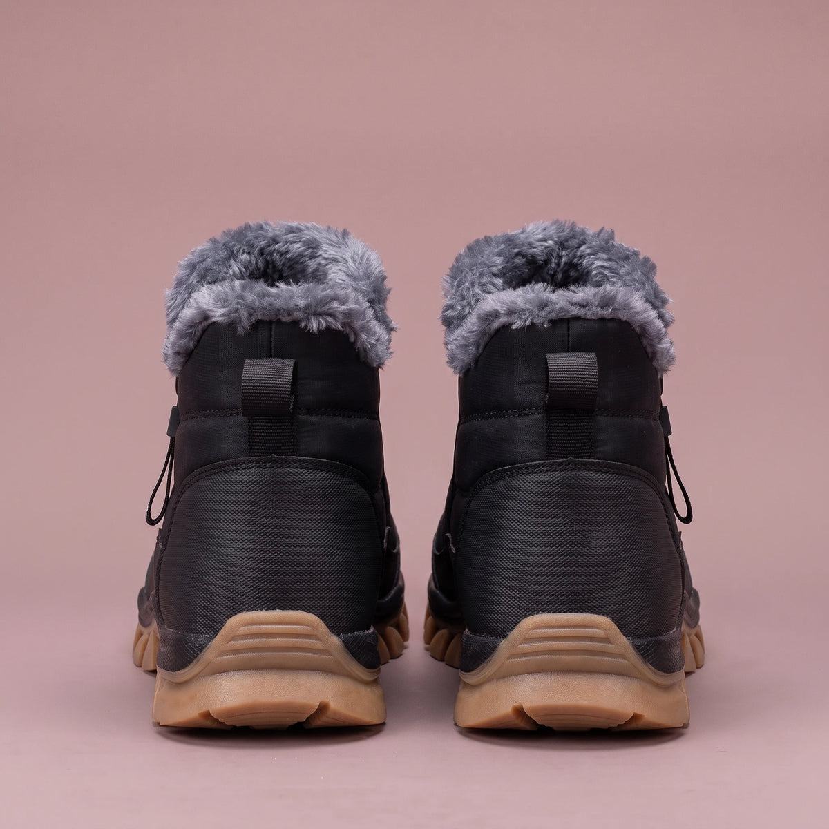 Halvard Fur-Lined Boot in black, men's quilted slip-on ankle boot with plush lining and side zip, pair back view