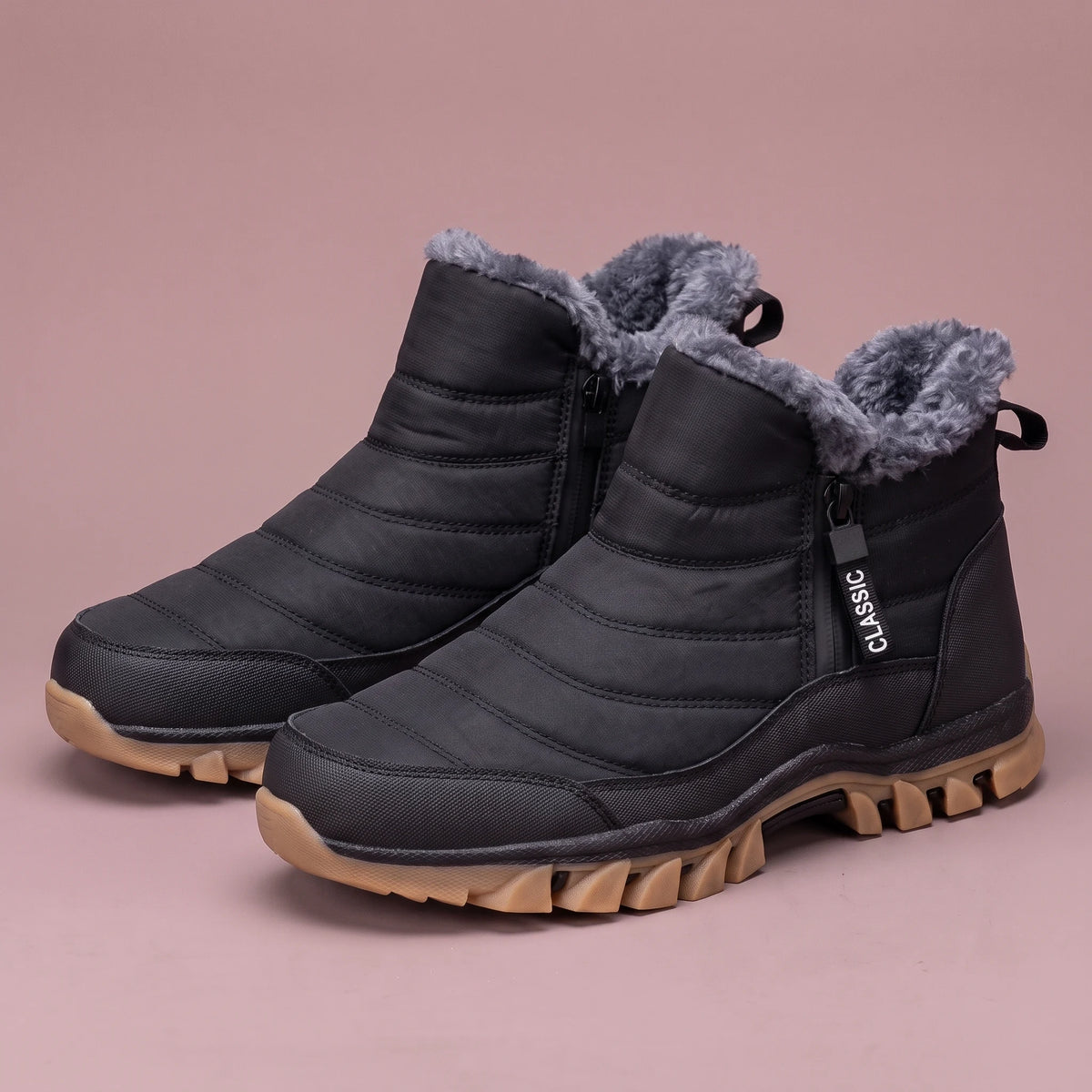 Halvard Fur-Lined Boot in black, men's quilted slip-on ankle boot with plush lining and side zip, pair front three-quarter view