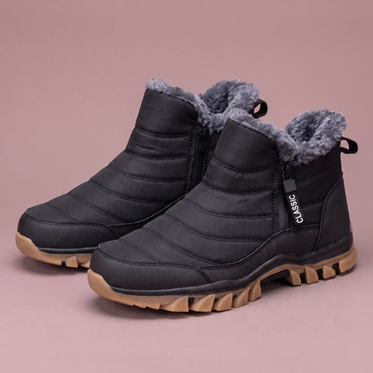 Halvard Fur-Lined Boot in black, men's quilted slip-on ankle boot with plush lining and side zip, pair front three-quarter view