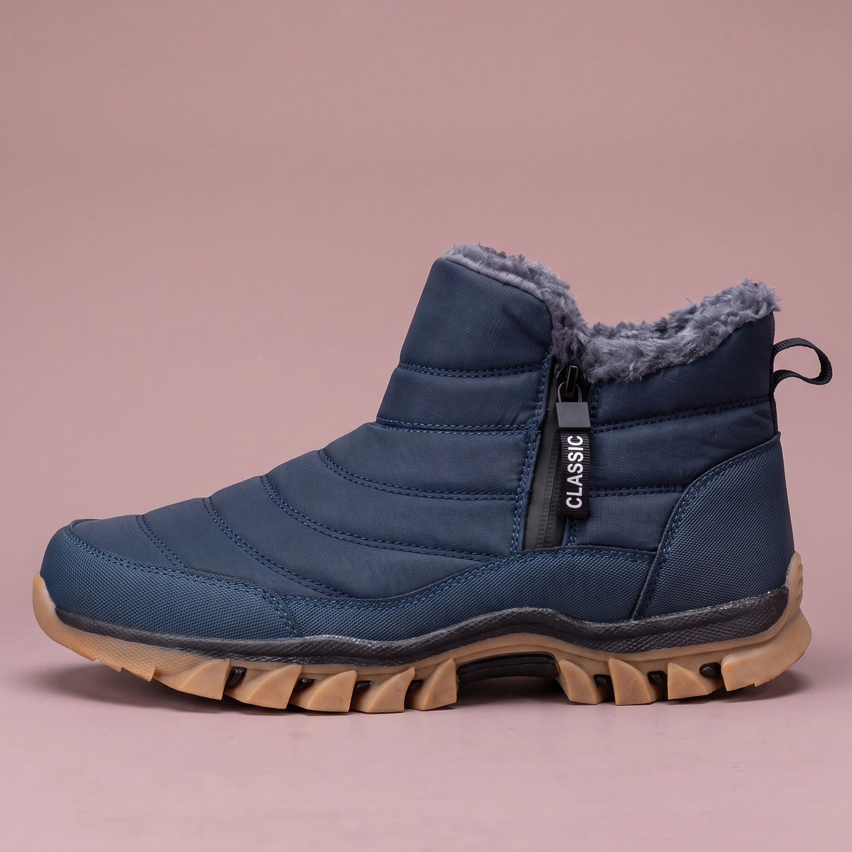 Halvard Fur-Lined Boot in blue, men's quilted slip-on ankle boot with plush lining and side zip, side view