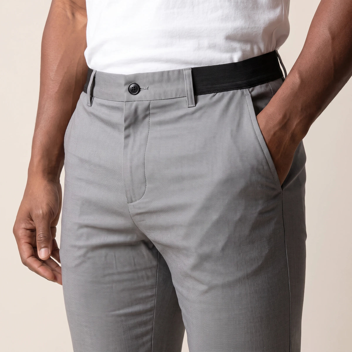 Keaton Ankle Trouser grey, close-up of the button front and side elastic waistband