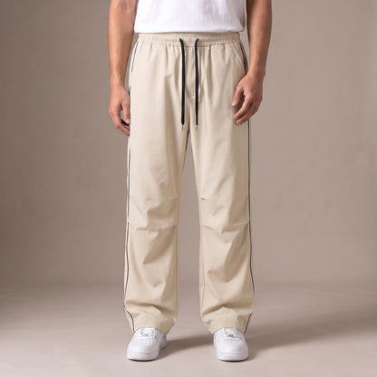 Merrick Piped Track Pant in beige, wide-leg track pants with black side piping and drawcord waist