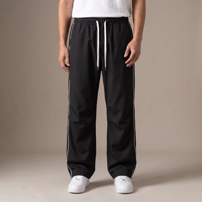 Merrick Piped Track Pant in black, wide-leg track pants with white side piping and drawcord waist