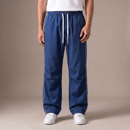 Merrick Piped Track Pant in blue, wide-leg track pants with white side piping and drawcord waist