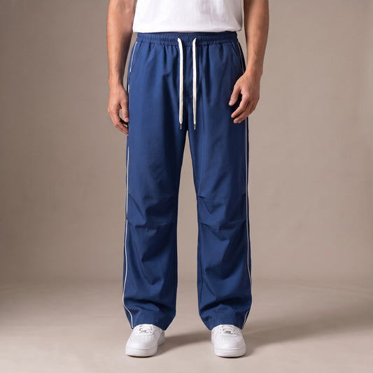Merrick Piped Track Pant in blue, wide-leg track pants with white side piping and drawcord waist