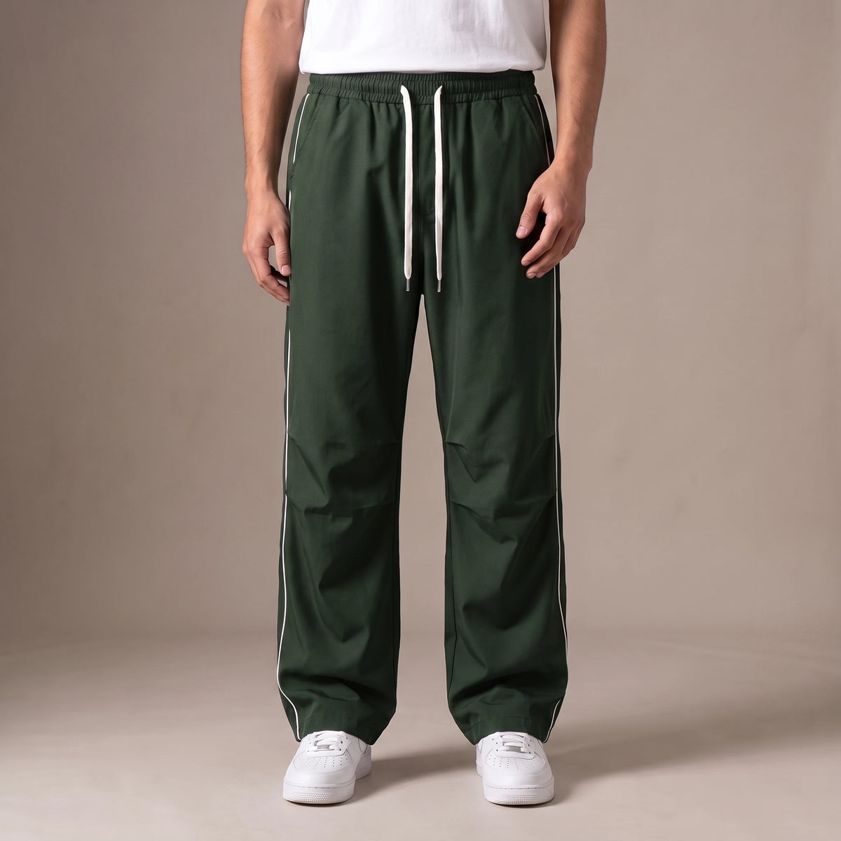 Merrick Piped Track Pant in green, wide-leg track pants with white side piping and drawcord waist