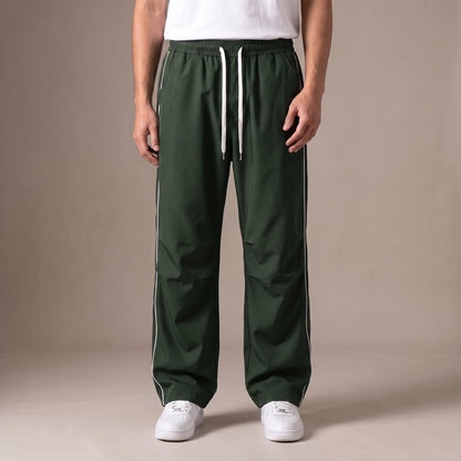 Merrick Piped Track Pant in green, wide-leg track pants with white side piping and drawcord waist