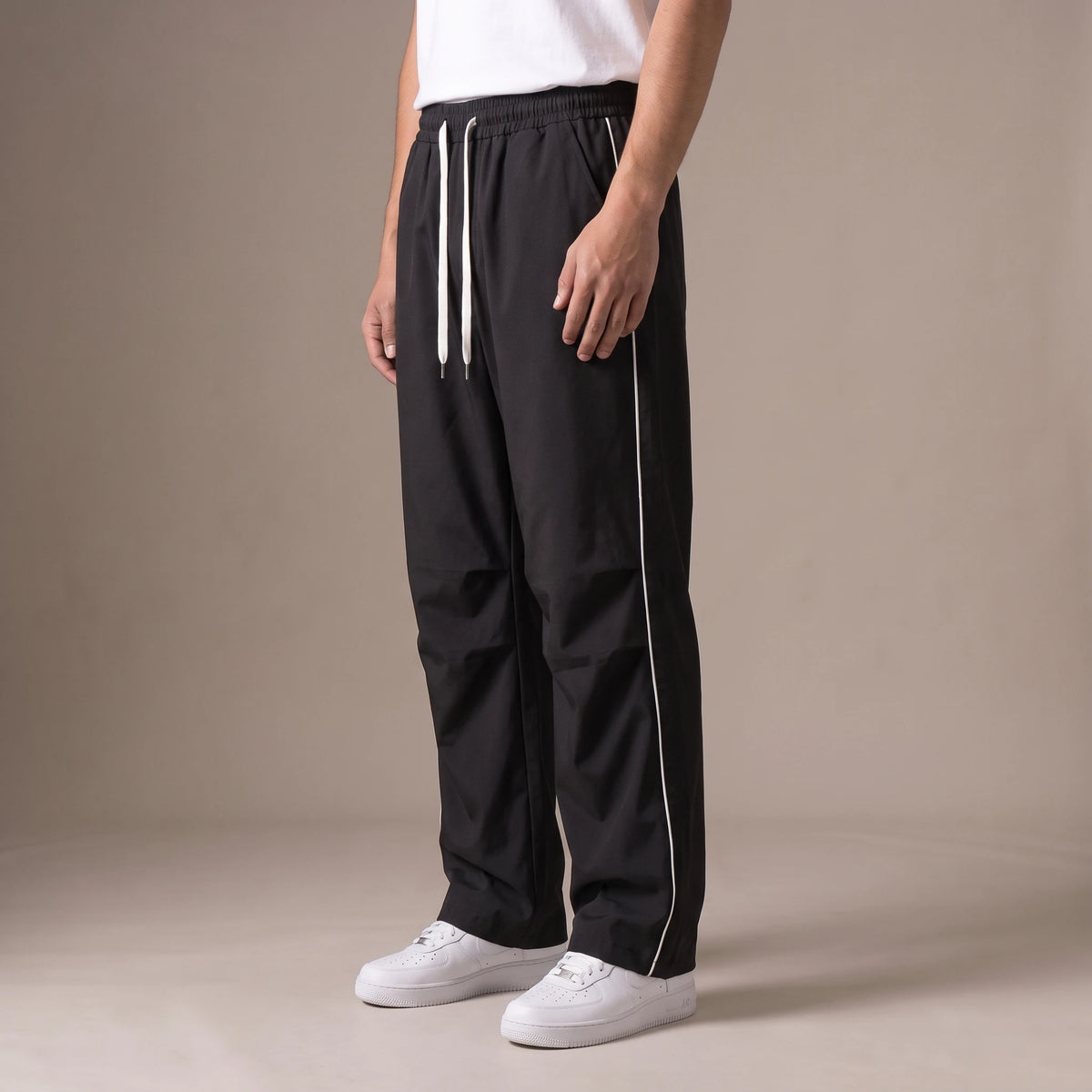 Merrick Piped Track Pant side view showing side stripe and straight wide leg