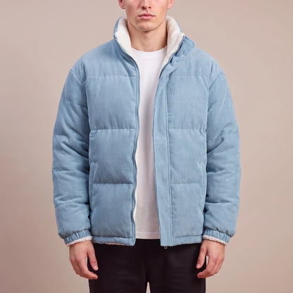 Morvane Fleece Puffer in blue, men's light blue corduroy puffer jacket with fleece-lined stand collar, worn front view