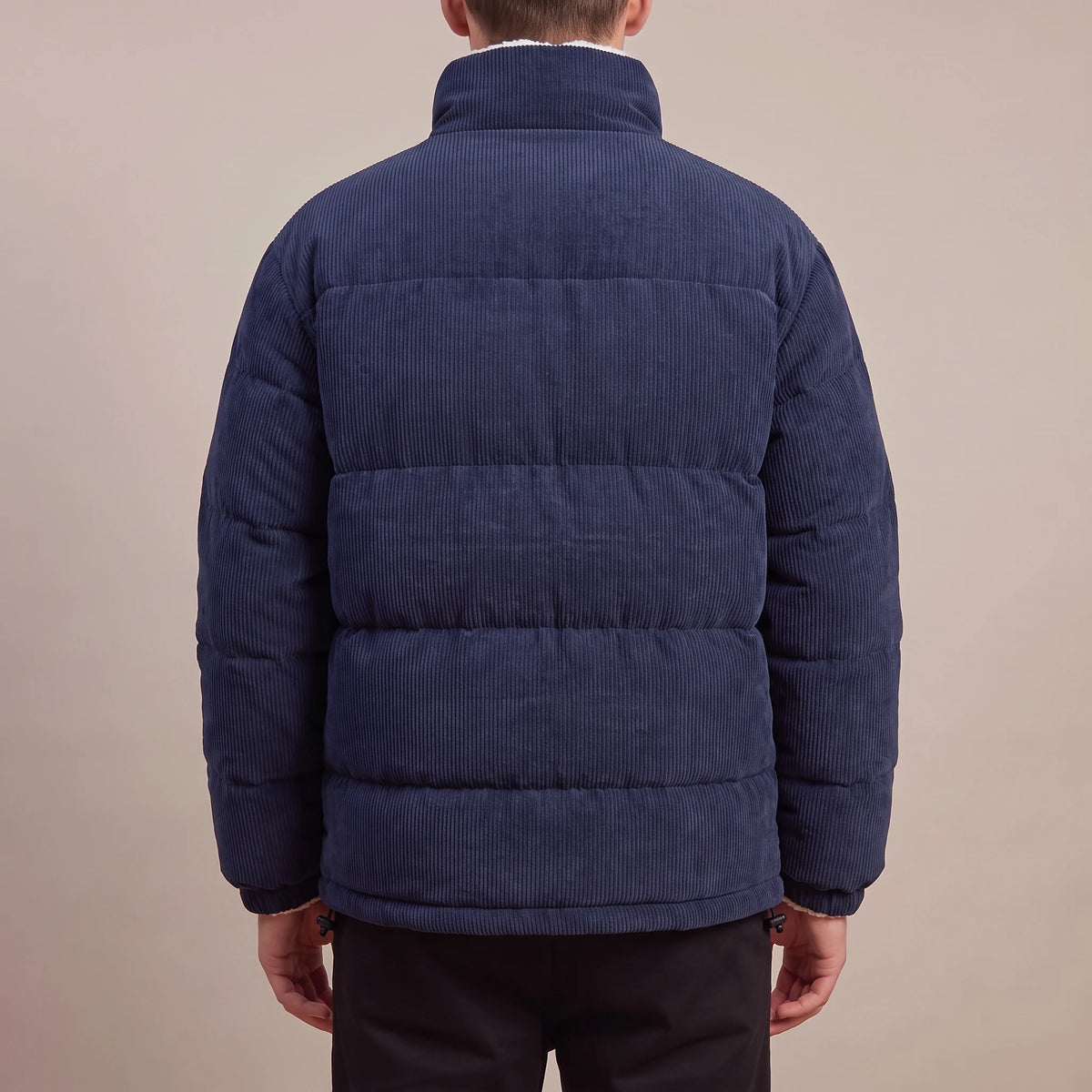 Morvane Fleece Puffer navy corduroy puffer jacket, back view on model showing quilted corduroy back