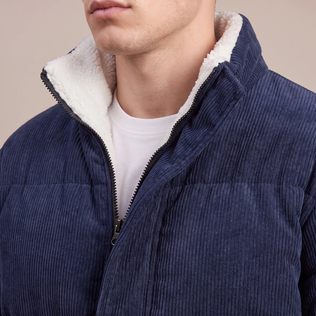 Morvane Fleece Puffer close-up of navy corduroy wale, fleece-lined stand collar and front zip
