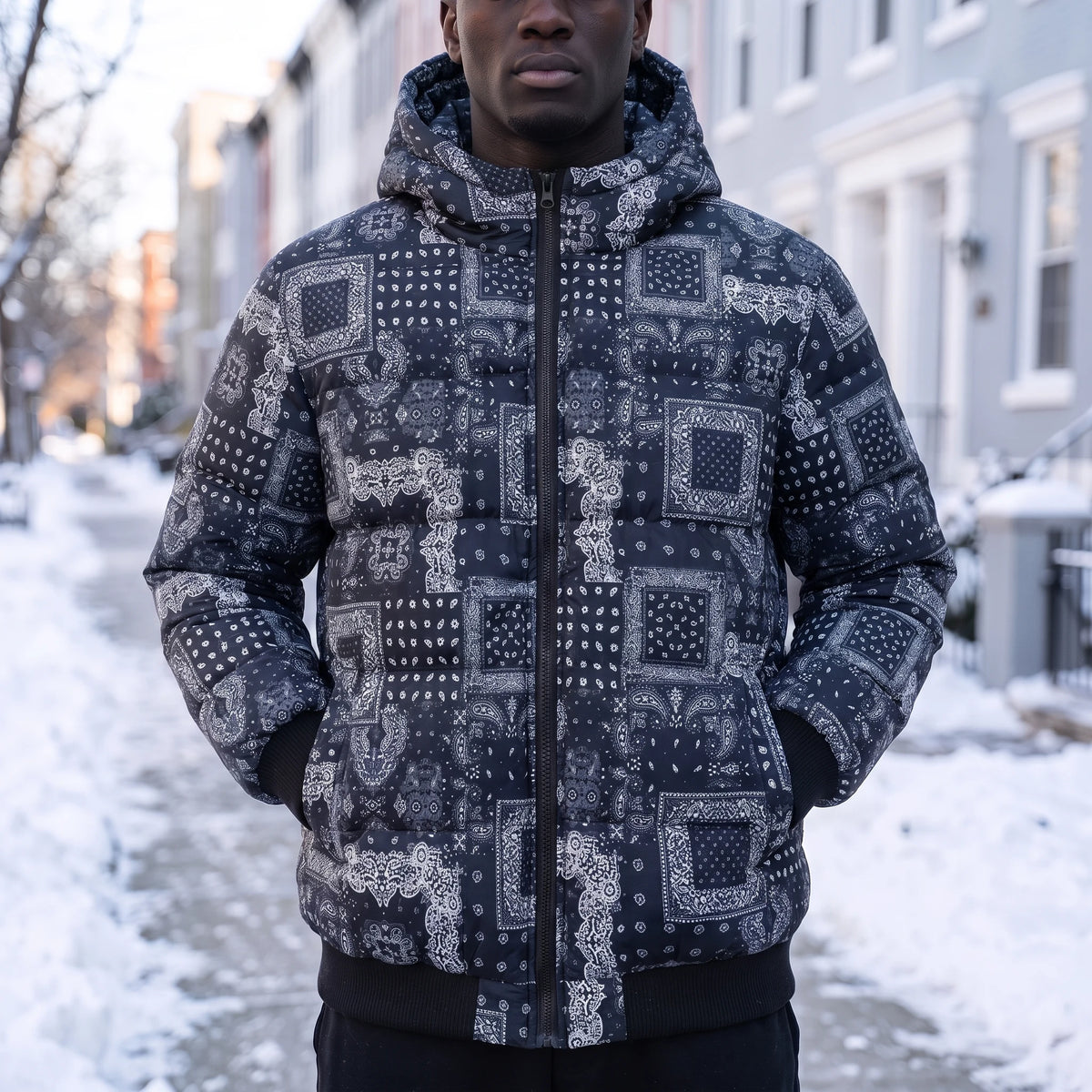 Rennick Paisley Puffer in blue, men's navy bandana patchwork print hooded puffer jacket, worn on snowy street