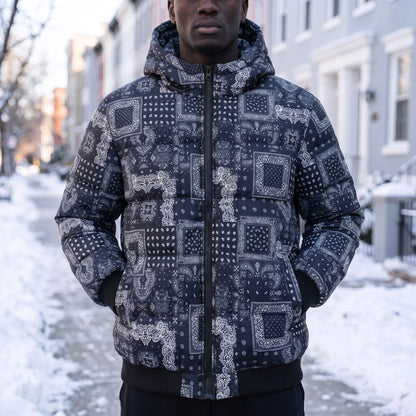 Rennick Paisley Puffer in blue, men's navy bandana patchwork print hooded puffer jacket, worn on snowy street