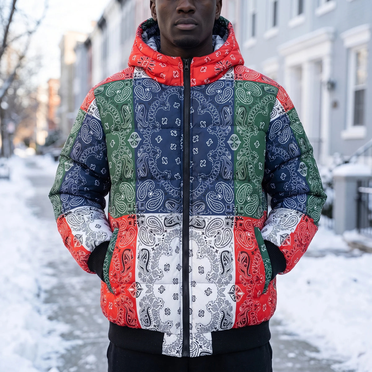Rennick Paisley Puffer in multi, men's red, navy, green and white bandana patchwork hooded puffer jacket, worn on snowy street